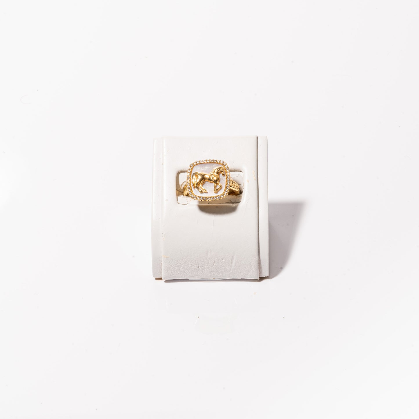 A photo of a Diamond & White Mother of Pearl Horse Ring.