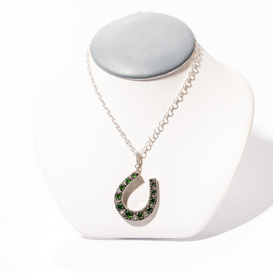 A photo of a Chrome Diopside & Diamond Horse Shoe Pendant by ZDNY & CO. 