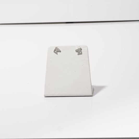 A photo of sparkly diamond horse head stud earrings. 