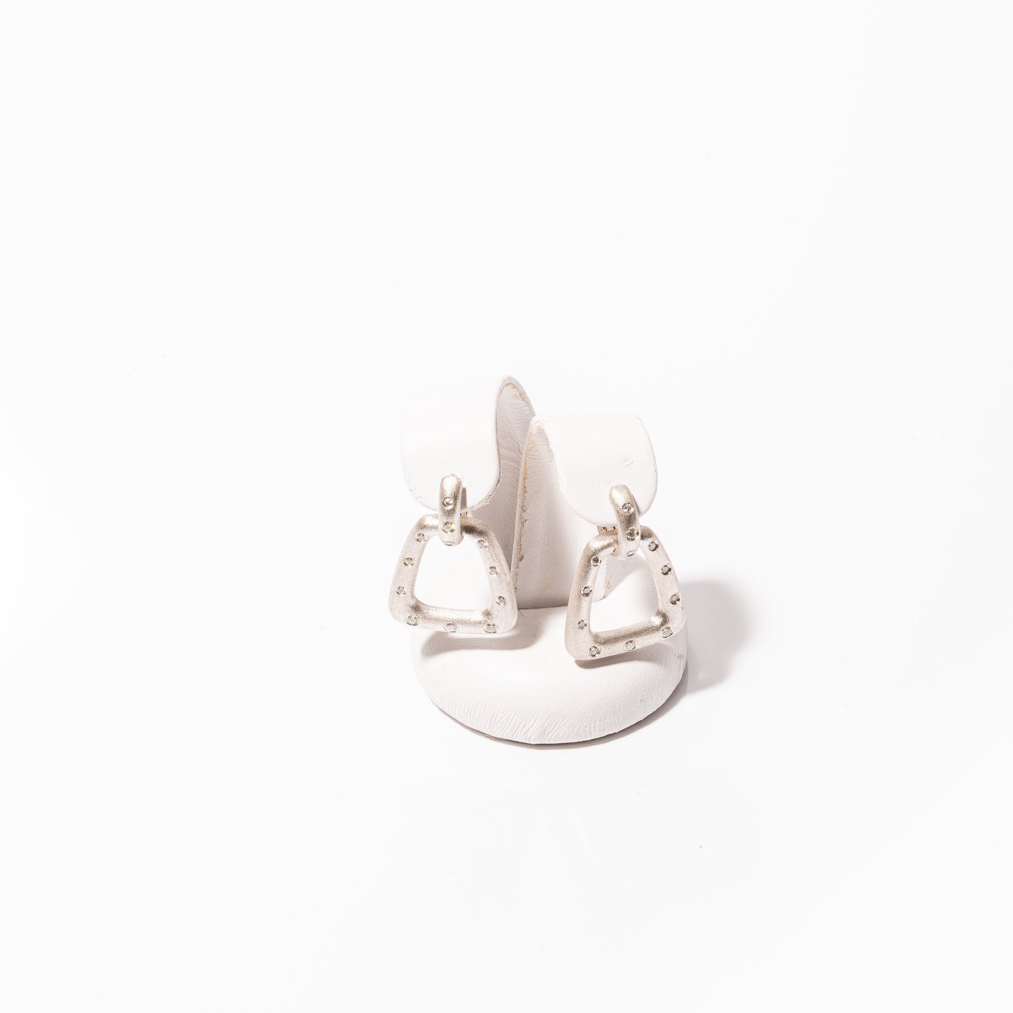 A photo of Nava Dee Stirrup Earrings in white gold.