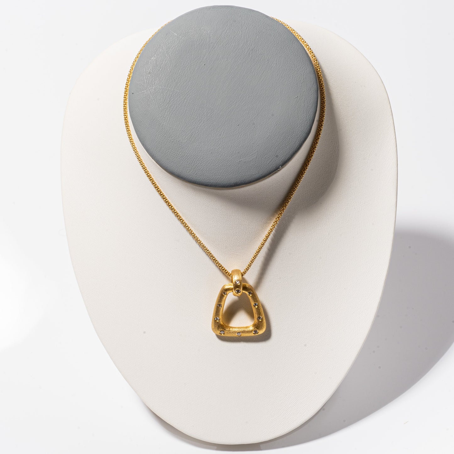 A photo of Nava Dee Yellow Gold Stirrup Necklace.