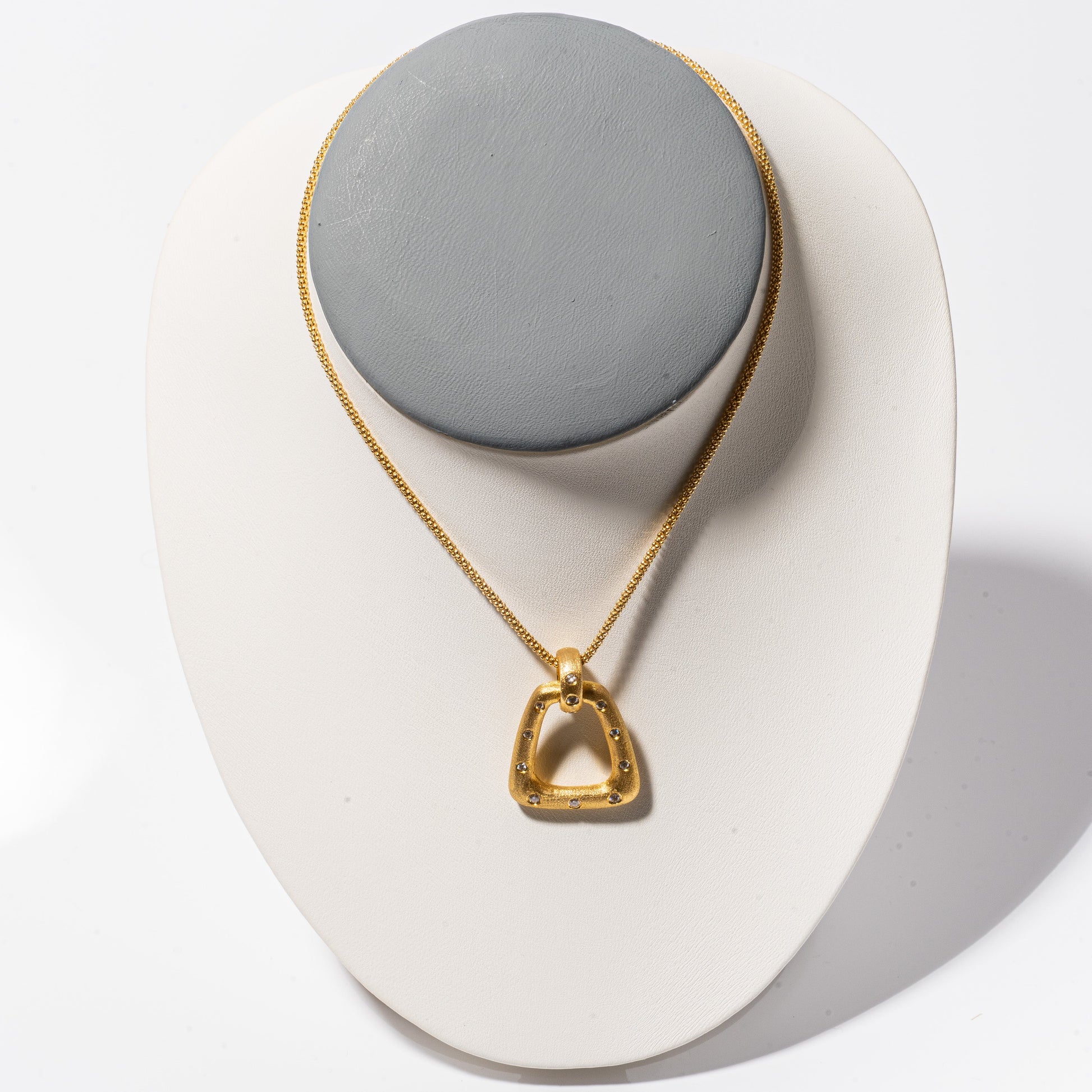 A photo of Nava Dee Yellow Gold Stirrup Necklace.