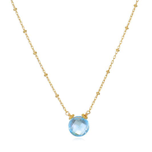A photo of Amelia Rose Topaz Coin Beaded Gold Necklace in Sky Blue.
